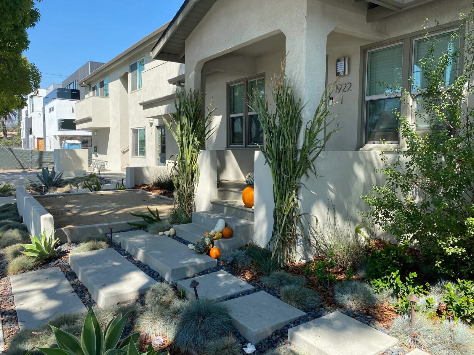Craftsman-style Penmar Lofts exterior with stucco facade and drought-tolerant front garden in Venice